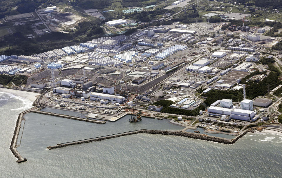 FILE - This aerial view shows the Fukushima Daiichi nuclear power plant in Fukushima, northern Japan, on Aug. 24, 2023, after its operator Tokyo Electric Power Company Holdings began releasing its first batch of treated radioactive water into the Pacific Ocean. A panel of safety experts commissioned by the operator of the tsunami-wrecked Fukushima Daiichi nuclear power plant in Japan urged the company Tuesday, Feb. 13, 2024, to communicate more quickly with the public over incidents such as last week's leak of contaminated water.(Kyodo News via AP, File)