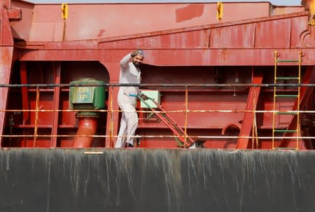 A member of the crew of the Iranian vessel Bavand is seen near the port of Paranagua