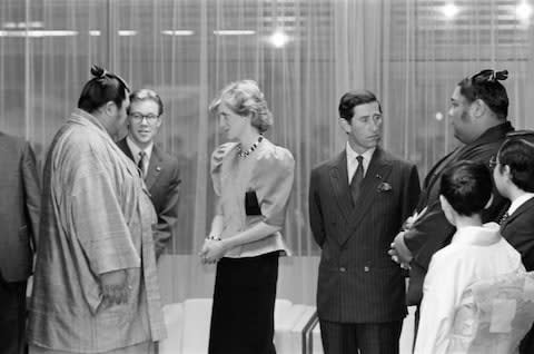 Charles and Diana meeting sumo wrestlers in 1986 - Credit: GETTY