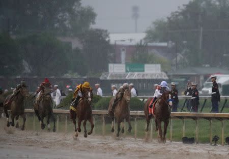 May 5, 2018; Louisville, KY, USA; Mike Smith aboard Justify (7) leads down the home stretch during the 144th running of the Kentucky Derby at Churchill Downs. Mandatory Credit: Mark Zerof-USA TODAY Sports