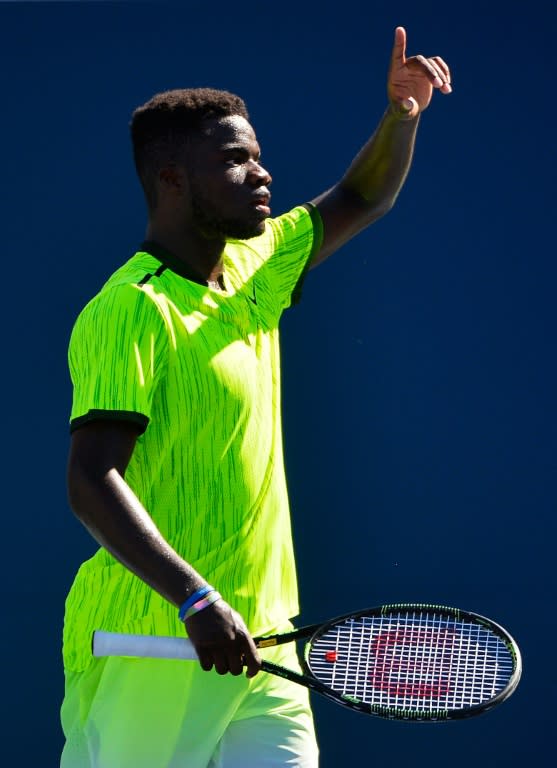 Frances Tiafoe questions a call during his first round match against John Isner at the US Open