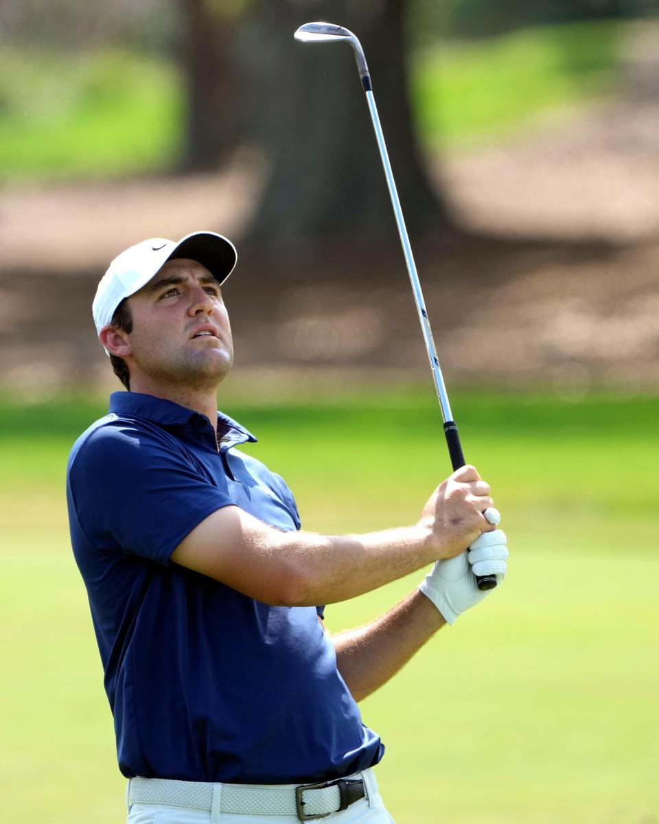 Scottie Scheffler follows his shot from the first fairway during final round of the Arnold Palmer Invitational golf tournament Sunday, March 5, 2023, in Orlando, Fla. (AP Photo/John Raoux)