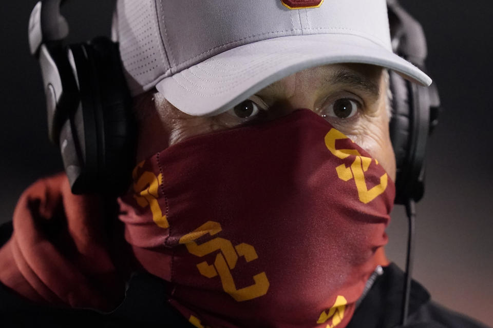 Southern California head coach Clay Helton looks on following an NCAA college football game against Utah Sunday, Nov. 22, 2020, in Salt Lake City. (AP Photo/Rick Bowmer)