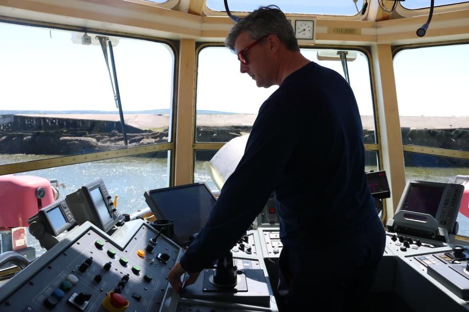 Gary Crowley, a tugboat captain of 25 years, who now trains other master mariners, navigates out of Pier 12 in west Saint John. 