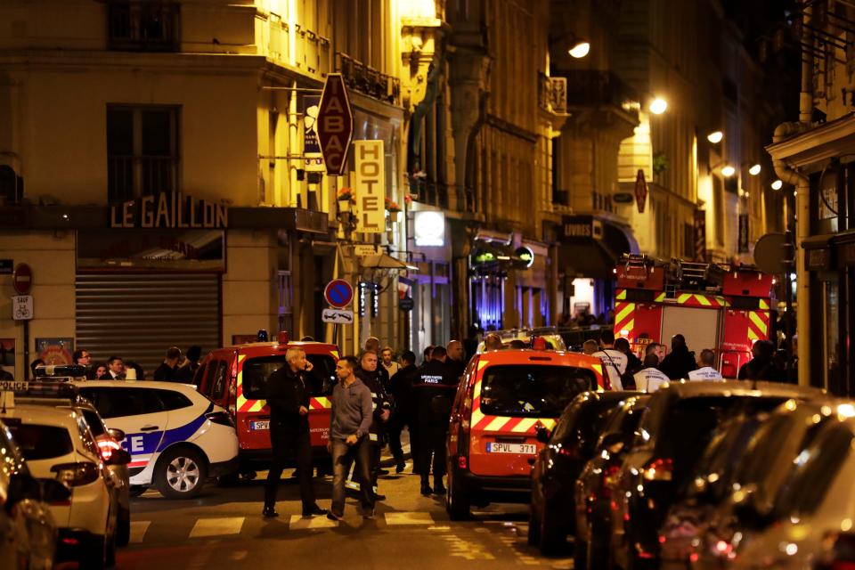 <p>Policemen and emergency service members stand in a blocked street in Paris centre after one person was killed and several injured by a man armed with a knife, who was shot dead by police in Paris on May 12, 2018. (Photo: Thomas Samson/AFP/Getty Images) </p>