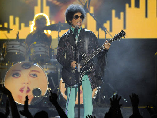 FILE - In this May 19, 2013 file photo, Prince performs at the Billboard Music Awards at the MGM Grand Garden Arena in Las Vegas. Several pills taken from Prince's estate in Paisley Park after his death were counterfeit drugs that actually contained fentanyl,a synthetic opioid 50 times more powerful than heroin, an official close to the investigation said Sunday, Aug. 21, 2016.   (Photo by Chris Pizzello/Invision/AP, File)