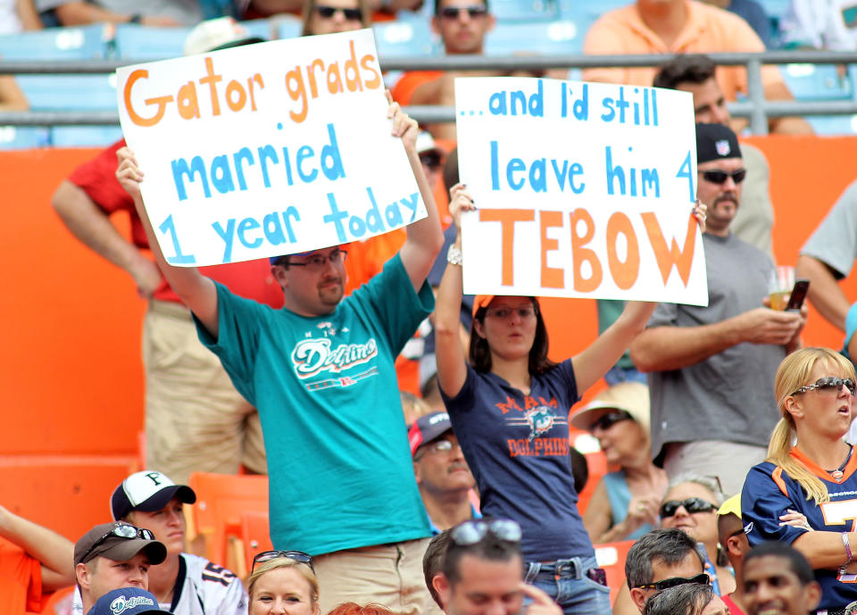 MIAMI GARDENS, FL - OCTOBER 23: Fans of Quarterback Tim Teebow #15 of the Denver Broncos cheer against the Miami Dolphins at Sun Life Stadium on October 23, 2011 in Miami Gardens, Florida. (Photo by Marc Serota/Getty Images)