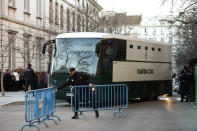 A bus belonging to Spain's Civil Guard allegedly carrying Catalonian politicians and activists, arrives at the Spanish Supreme Court in Madrid, Tuesday, Feb. 12, 2019. Spain is bracing for the nation's most sensitive trial in four decades of democracy this week, with a dozen Catalan separatists facing charges including rebellion over a failed secession bid in 2017. (AP Photo/Manu Fernandez)