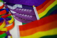 Rainbow flags lie on the desk of Liu Yifu, an organiser of a 5.17 km run to mark International Day Against Homophobia in Beijing, China, May 17, 2018. REUTERS/Thomas Peter