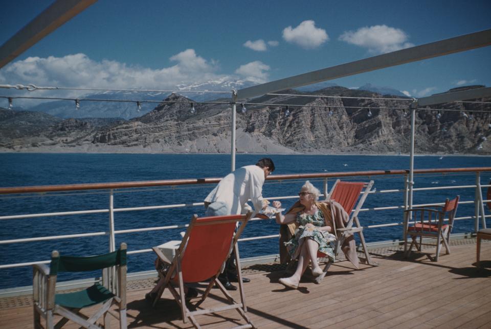 A mid-morning snack on the cruise ship 'Agamemnon', anchored off Agia Galini in southern Crete, Greece, 12th April 1959.