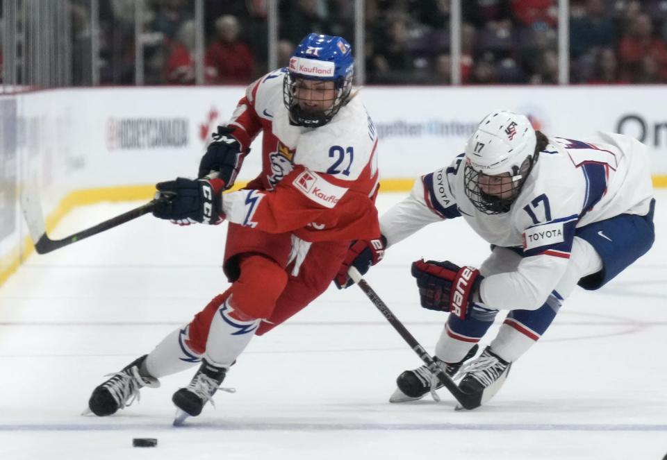 Czechia forward Tereza Vanisova drives past U.S. forward Britta Curl during a second period semifinal IIHF Women’s World Hockey Championship hockey action in Brampton, Ont. on April 15, 2023. THE CANADIAN PRESS/Nathan Denette