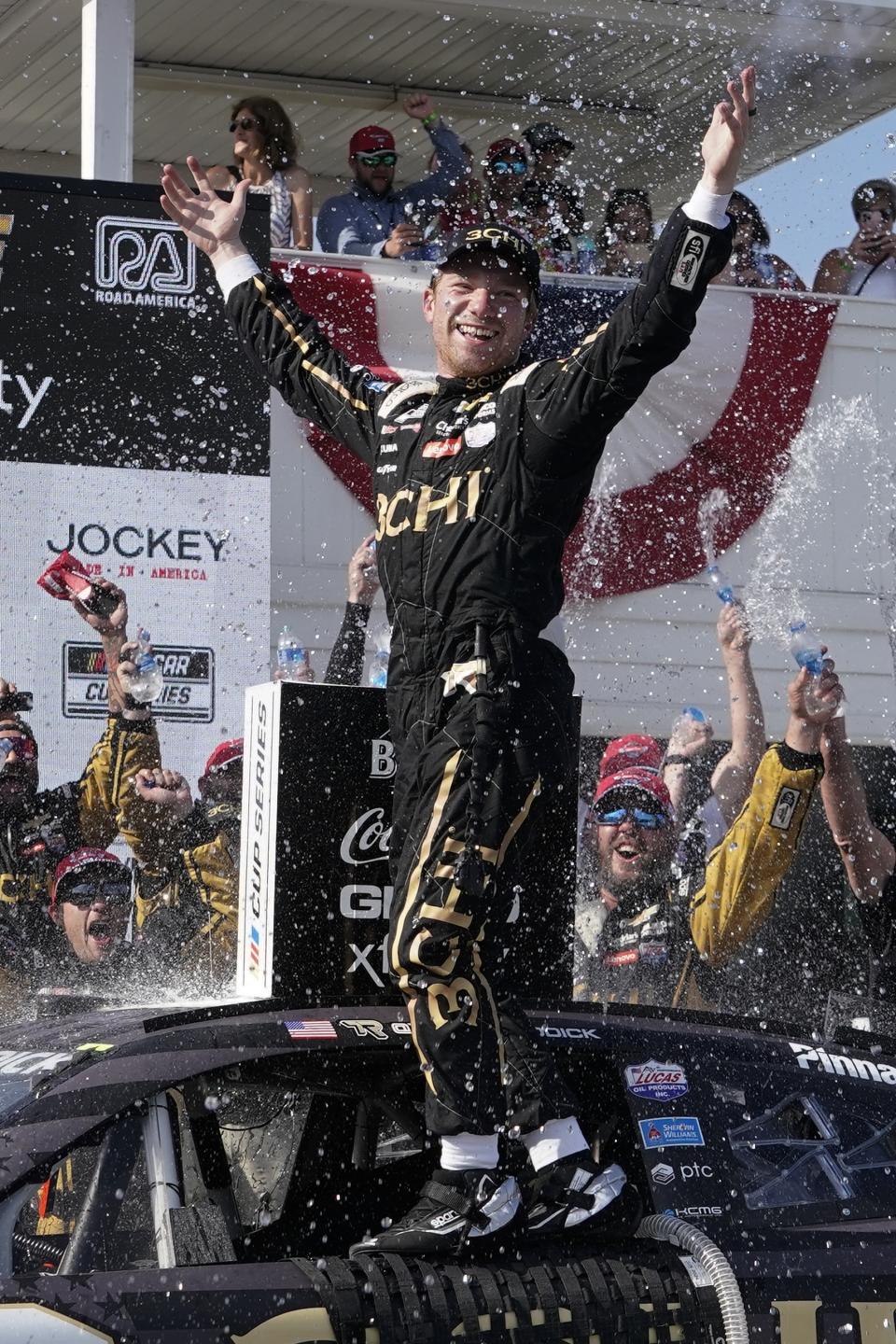 Tyler Reddick reacts after winning the Kwik Trip 250 after a NASCAR Cup Series auto race Sunday, July 3, 2022, at Road America in Elkhart Lake, Wis. (AP Photo/Morry Gash)