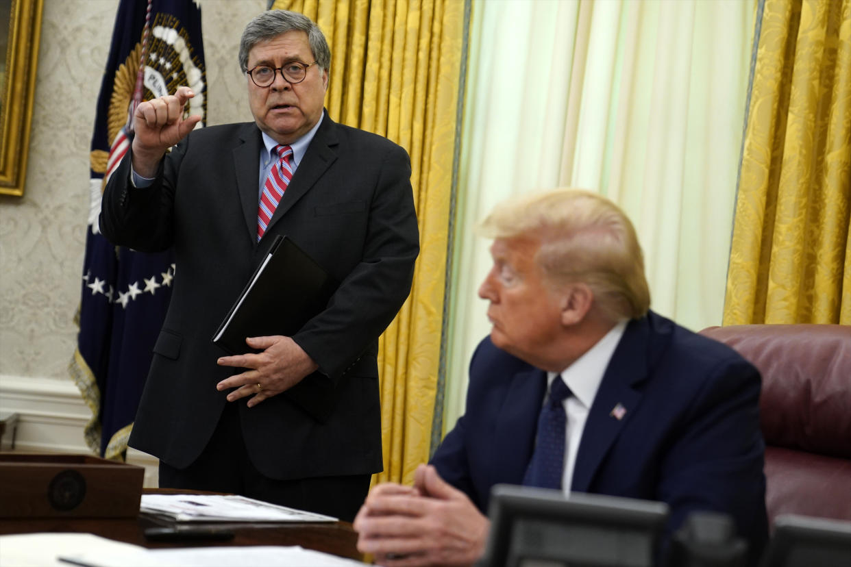 President Donald Trump listens as Attorney General William Barr speaks before Trump signs an executive order aimed at curbing protections for social media giants, in the Oval Office of the White House, Thursday, May 28, 2020, in Washington. (AP Photo/Evan Vucci)