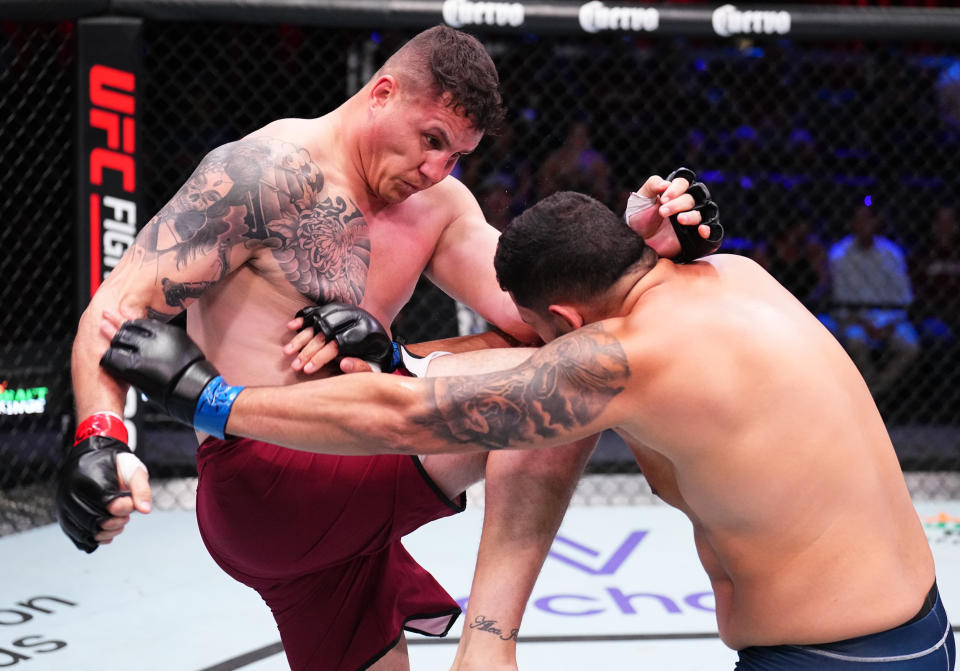 LAS VEGAS, NEVADA – SEPTEMBER 12: (L-R) Jhonata Diniz of Brazil knees Eduardo Neves of Brazil in a heavyweight fight during Dana White’s Contender Series season seven, week six at UFC APEX on September 12, 2023 in Las Vegas, Nevada. (Photo by Chris Unger/Zuffa LLC via Getty Images)