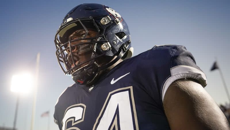 UConn offensive lineman Christian Haynes (64) celebrates after a play against North Carolina State in East Hartford, Conn., Thursday, Aug. 31, 2023. The Huskies will host Utah State Saturday.