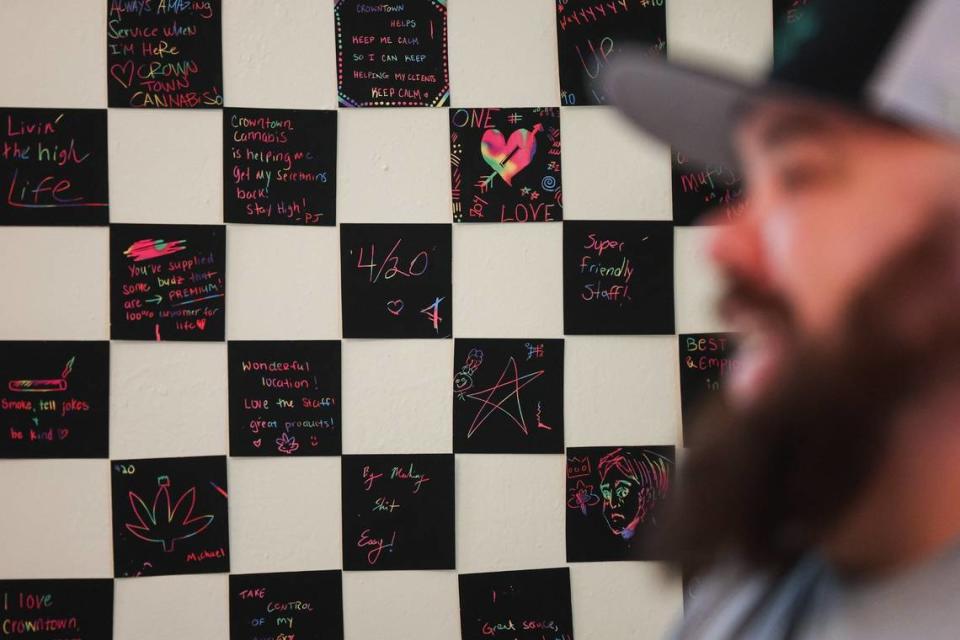 Notes of praise from customers line the wall of a lounge inside Crowntown Cannabis on North Davidson Street on Tuesday, April 9, 2024