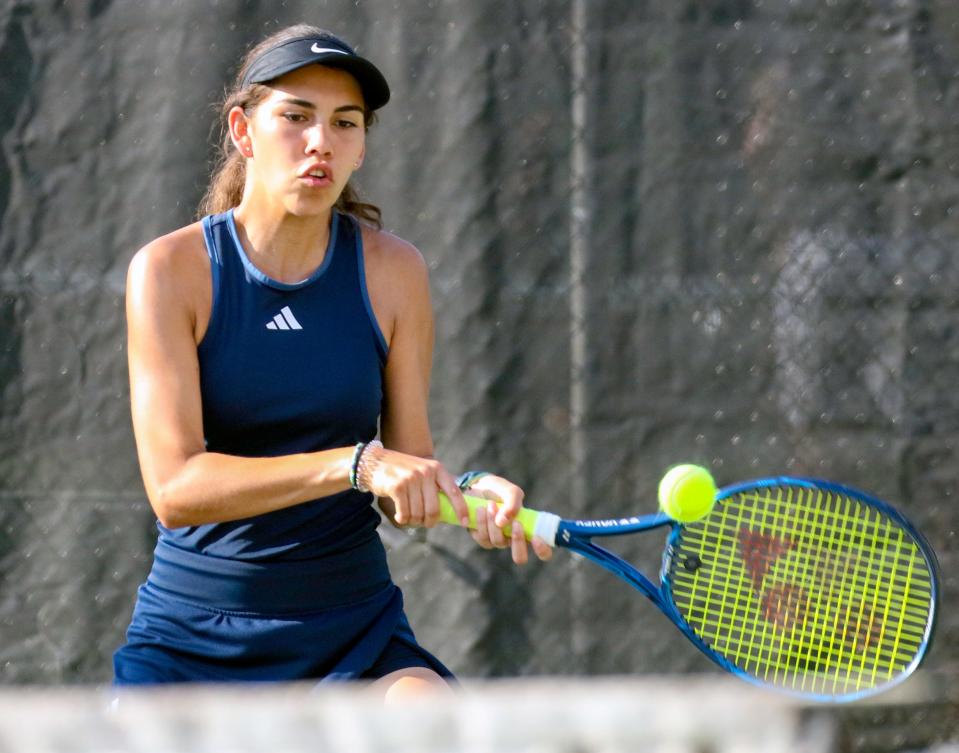 McKeel's Jada Hutto returns a backhand during the No. 1 doubles semifinals. Hutto won at No. 1 singles and with Sarah Steeves at No. 1 doubles on Tuesday in the West County Tennis Tournament.