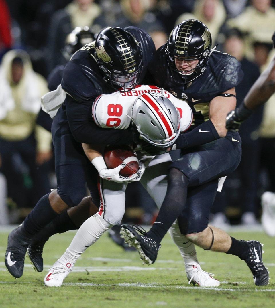 Ohio State receiver C.J. Saunders is stopped by Purdue defenders on Oct. 20, 2018.