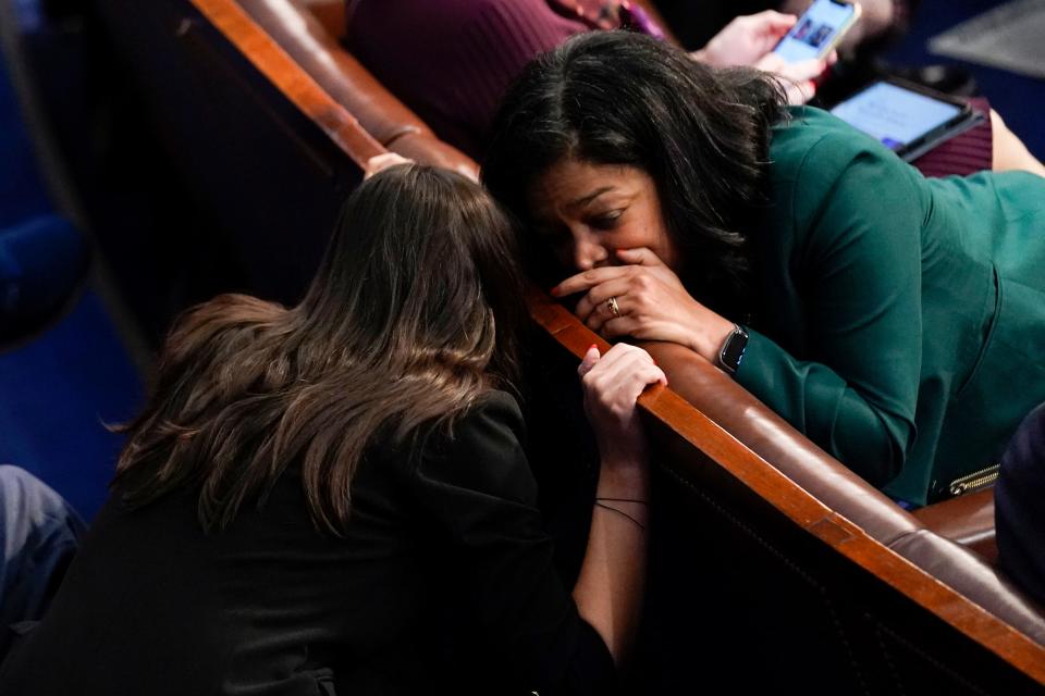 Rep. Alexandria Ocasio-Cortez, D-N.Y., left, talks with Rep. Rashida Tlaib, D-Mich., in the House chamber as the House meets for a second day to elect a speaker and convene the 118th Congress in Washington, Wednesday, Jan. 4, 2023.