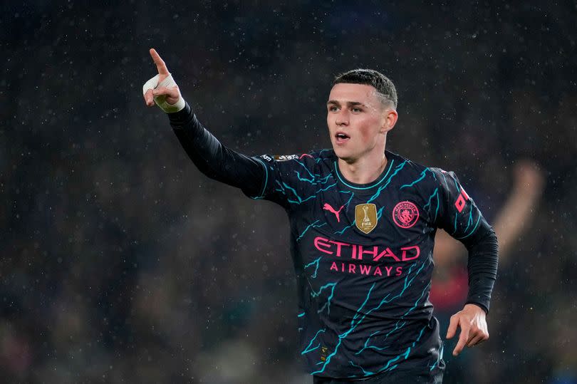 Manchester City's Phil Foden celebrates after scoring his side's third goal during the English Premier League match between Brighton and Manchester City