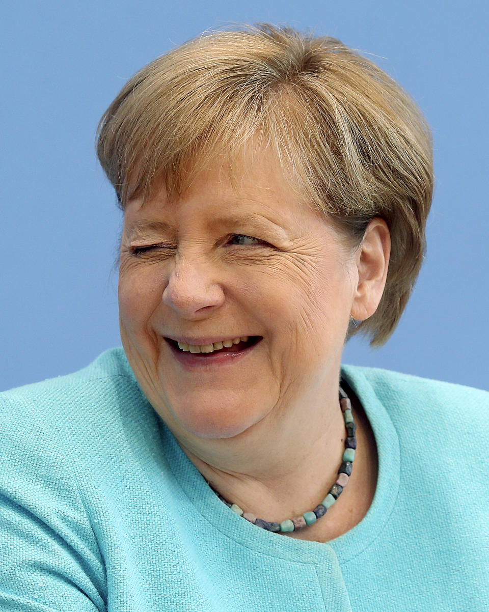 German Chancellor Angela Merkel,gestures as she holds her annual summer news conference in Berlin, Germany, Thursday, July 22, 2021. (Wolfgang Kumm/dpa via AP)