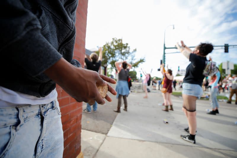 People gather at the Minneapolis Police Department's Third Precinct station to protest the death of George Floyd, in Minneapolis, Minnesota