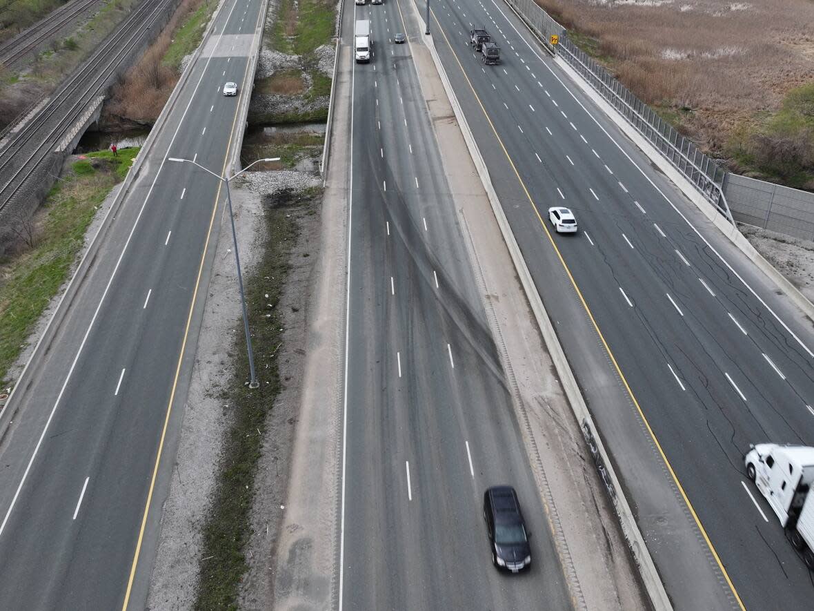 Six vehicles were involved in a crash on Highway 401 that killed an infant boy and his two grandparents on Monday. (Patrick Morrell/CBC - image credit)