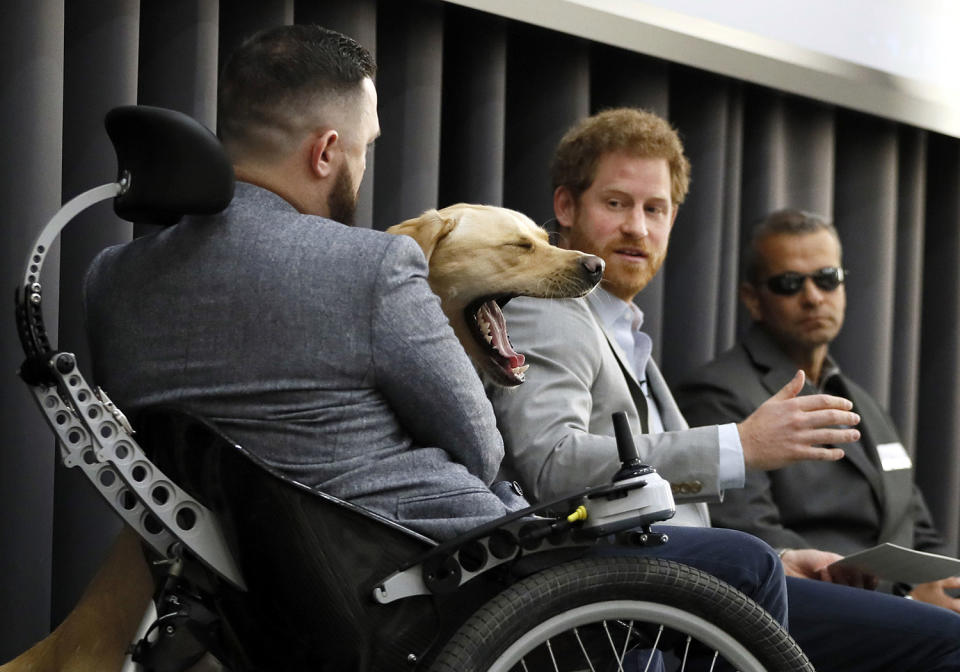 Cooper yawns at a panel discussion