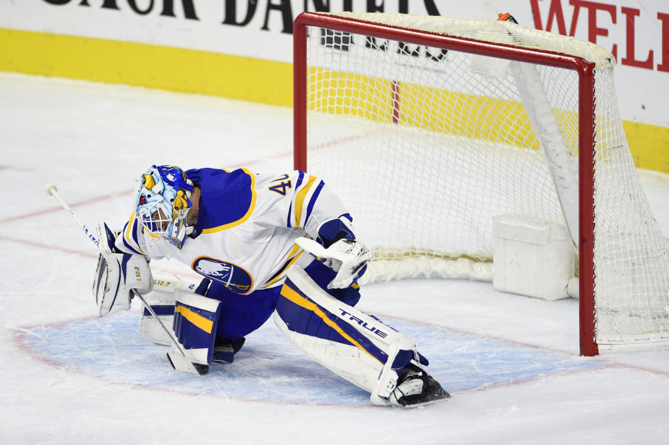 Buffalo Sabres goaltender Carter Hutton is unable to make a save on a goal scored by Philadelphia Flyers' Travis Konecny during the second period of an NHL hockey game, Tuesday, Jan. 19, 2021, in Philadelphia. (AP Photo/Derik Hamilton)