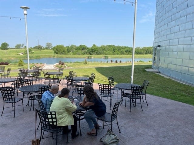 Members of Cornerstone Church find a quiet spot after the service Sunday, June 4, 2023 to honor the anniversary of the killings of Eden Montang and Vivian Flores.