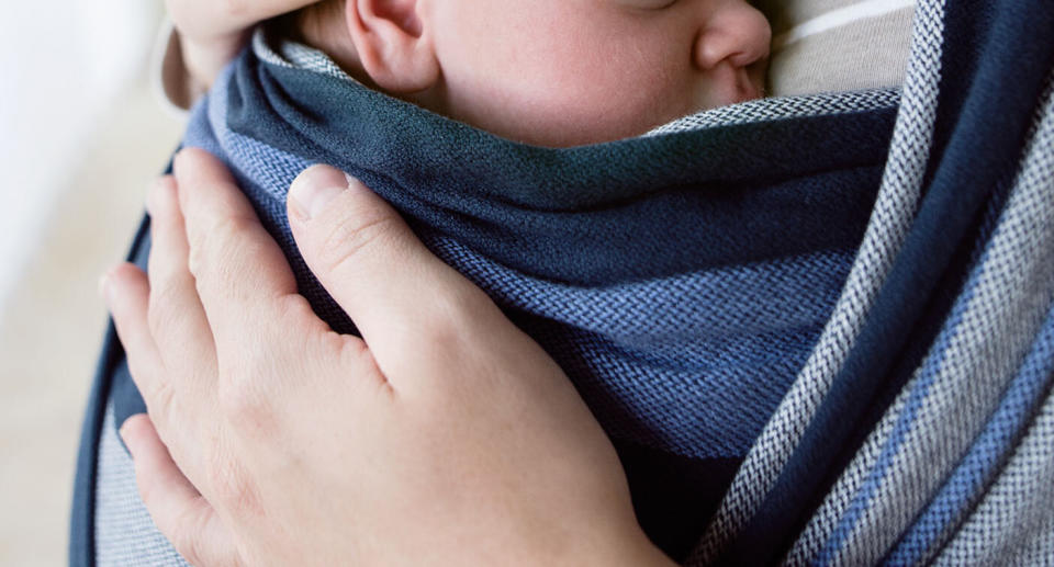 The newborn was being carried in a sling when he stopped breathing. Source: Getty/STOCK