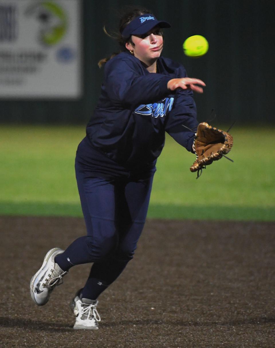Bartlesville High School's Lola Redington second baseman (20) throws an out at first base during slowpitch softball action earlier in the season.