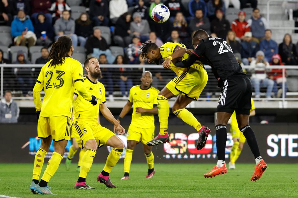 Apr 8, 2023; Washington, District of Columbia, USA; D.C. United forward Christian Benteke (20) and Columbus Crew SC defender Steven Moreira (31) leap to head the ball in the second half at Audi Field. Mandatory Credit: Geoff Burke-USA TODAY Sports