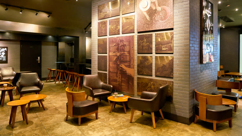 Tables and chairs in an empty Starbucks interior