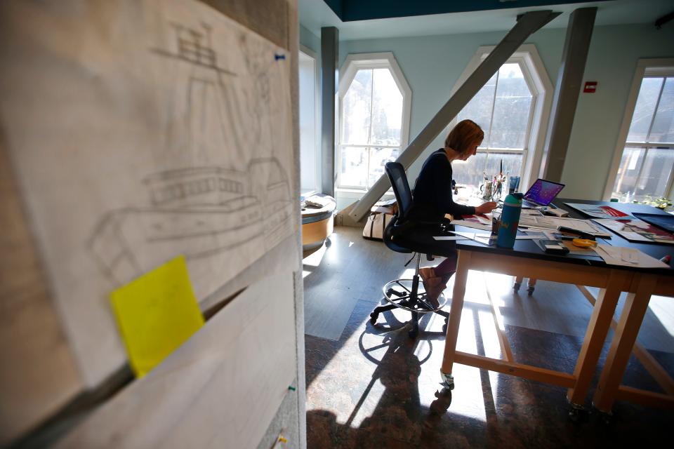 Margo Connolly-Masson works on her new children's book, "And Then... Glen!" at the Corson Building, which is part of the New Bedford Whaling National Historical Park.