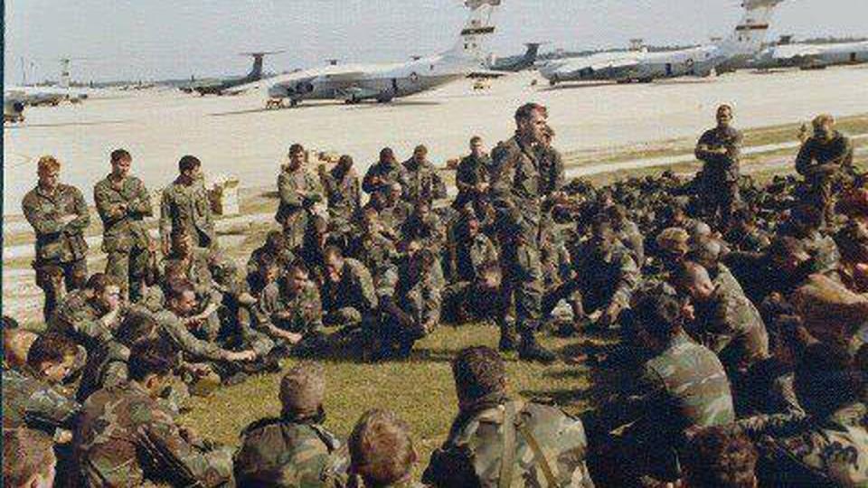 Capt. Ben Morris, commander of Company C, 2nd Battalion, 505th Parachute Infantry Regiment, briefs paratroopers on Pope Airfield on Oct. 24, 1983, before they loaded onto the aircraft bound for the island nation of Grenada. (Army)