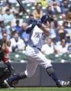 May 23, 2018; Milwaukee, WI, USA; Milwaukee Brewers third baseman Travis Shaw (21) hits a three-run home run in the fourth inning against the Arizona Diamondbacks at Miller Park. Mandatory Credit: Benny Sieu-USA TODAY Sports