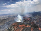 <p>This Monday, June 26, 2017, photo provided by the Utah Governor’s Office, shows fire activity near Parowan, during a tour by Utah Lt. Gov. Spencer Cox, in southern Utah. (Justin Harding/Utah Governor’s Office via AP) </p>