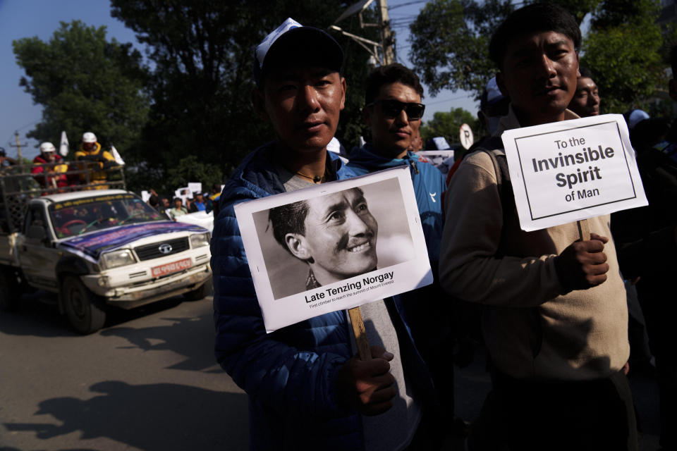 People from the mountaineering community, Sherpa guides and officials participate in a rally to mark the 70 anniversary of the first ascent of Mount Everest in Kathmandu, Nepal, Monday, May 29, 2023. The 8,849-meter (29,032-foot) mountain peak was first scaled by New Zealander Edmund Hillary and his Sherpa guide Tenzing Norgay on May 29, 1953. (AP Photo/Niranjan Shrestha)