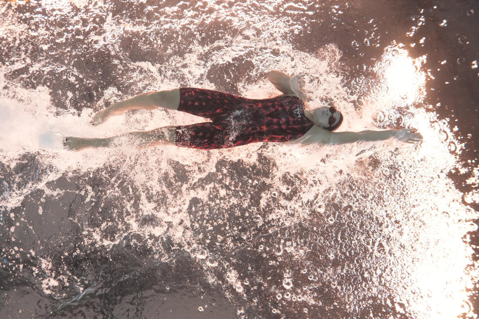 Adriana Giles of Bolivia competes in the women's 100-meter freestyle heat at the World Aquatics Championships in Doha, Qatar, Thursday, Feb. 15, 2024. (AP Photo/Lee Jin-man)