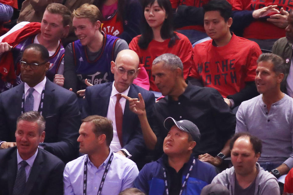 NBA Commissioner Adam Silver and former President of the United States, Barack Obama speak in the first half during Game Two of the 2019 NBA Finals between the Golden State Warriors and the Toronto Raptors at Scotiabank Arena on June 02, 2019 in Toronto, Canada.  NOTE TO USER: User expressly acknowledges and agrees that, by downloading and or using this photograph, User is consenting to the terms and conditions of the Getty Images License Agreement. (Photo by Gregory Shamus/Getty Images)