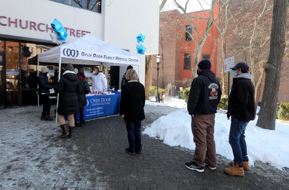 People line up for free Covid-19 home tests during an outreach event at the Open Door Family Medical Center in Ossining Feb.1, 2022.