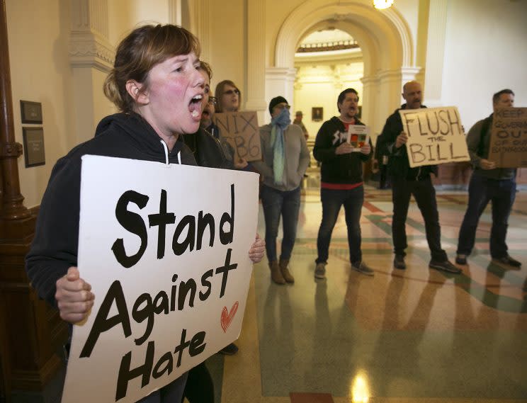 Protestors try to drown out a press conference with Texas Lt. Gov. Dan Patrick and Senator Lois Kolkhorst as they introduce Senate Bill 6 known as the Texas Privacy Act at the state Capitol, Jan. 5, 2017. (Photo: Ralph Barrera/Austin American-Statesman via AP)