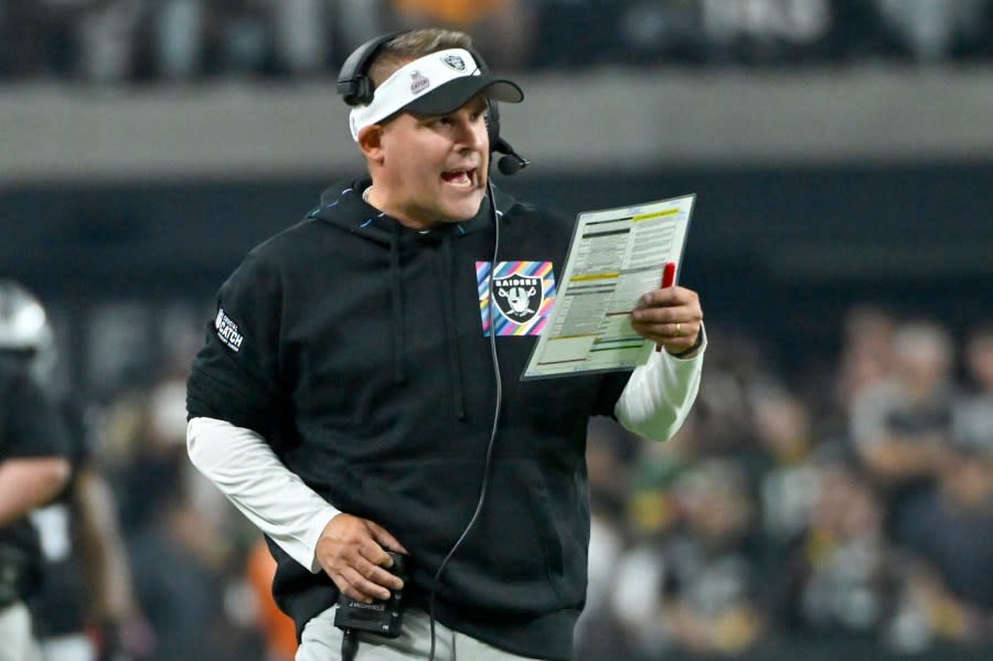 Las Vegas Raiders head coach Josh McDaniels calls a play during the second half of an NFL football game against the Green Bay Packers Monday, Oct. 9, 2023, in Las Vegas. (AP Photo/David Becker)