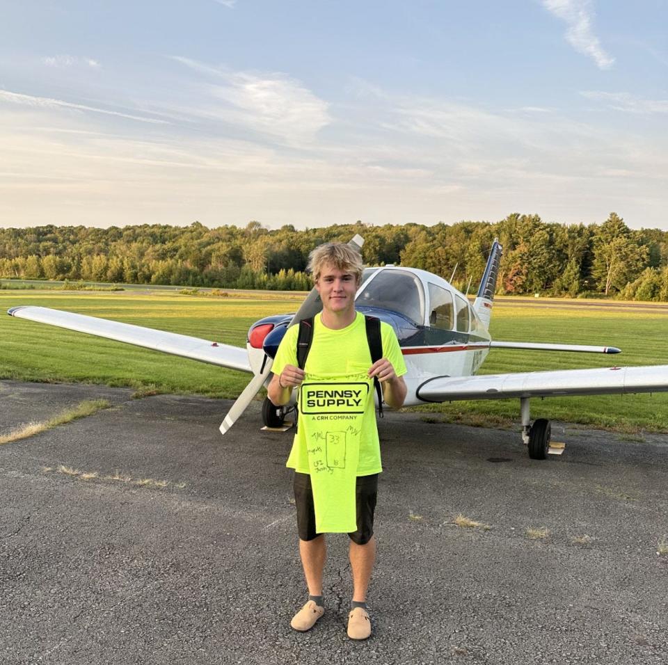 Grady Hearn is pictured at Cherry Ridge Airport after his first solo flight. Several of the Wallenpaupack Aeronautical Science & Aviation (WASA) students have taken flight training at local airports on weekends.