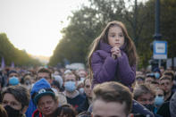 A child sits on a man's shoulders as Hungarian opposition supporters listen to a speech by Prime Minister candidate Peter Marki-Zay during celebration the 65th anniversary of the 1956 Hungarian revolution, in Budapest, Hungary, Saturday, Oct. 23, 2021. Earlier thousands of supporters of Prime Minister Viktor Orban, who delivered a speech marking the 65th anniversary of the 1956 Hungarian revolution, marched to demonstrate loyalty to his right-wing government. (AP Photo/Laszlo Balogh)