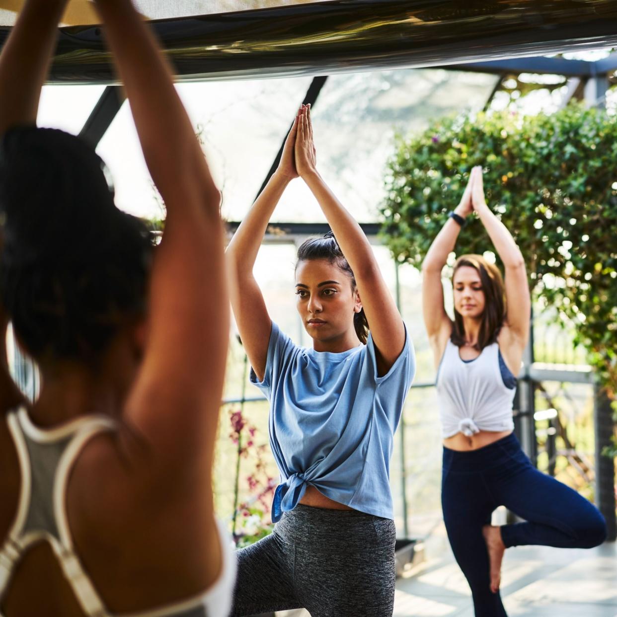 Diverse Group of Woman Following Yoga Instructor
