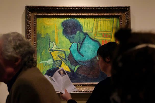 PHOTO: Visitors file past at the Van Gogh painting 'Une Liseuse De Romans', also known as 'The Novel Reader', during the Van Gogh in America exhibit at the Detroit Institute of Arts, Jan. 11, 2023, in Detroit. (Andy Morrison/AP)