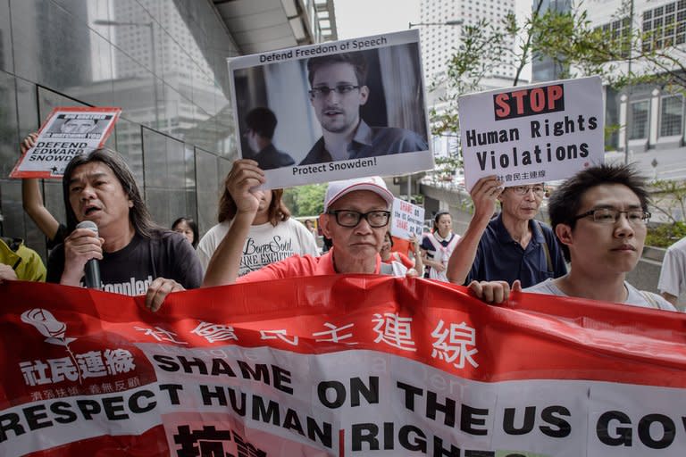 Protesters rally in support of former US spy Edward Snowden in Hong Kong on June 13, 2013. Half of Hong Kongers believe the city's government should not extradite former US spy Edward Snowden, according to a poll published a day after hundreds protested in his support