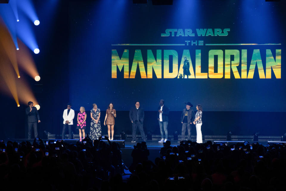 The cast and crew behind The Mandalorian introduce fans to the premiere of The Mandalorian's third season trailer at D23 Expo in 2022.